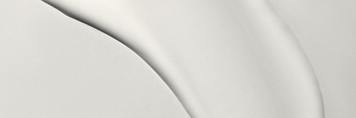 Smooth cream swatch on a pale background