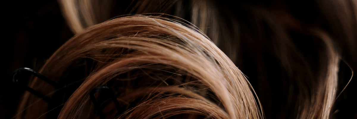 Glossy brown hair styled in a twist