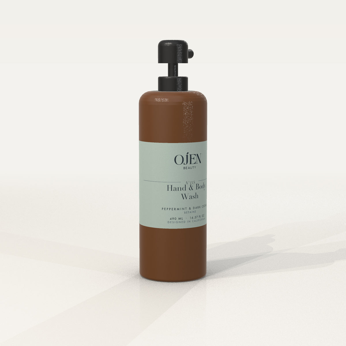 Ojen® N°115 Hand & Body Wash, Peppermint & Dark Cedar (Amber Bottle) — angled view